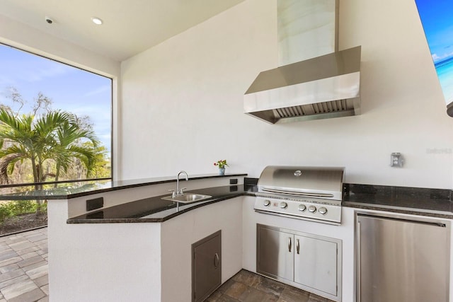 view of patio / terrace featuring a grill, an outdoor kitchen, and sink