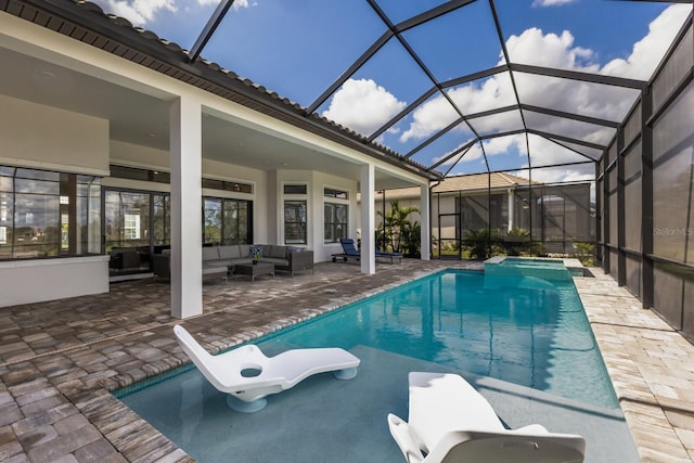 view of pool with a lanai, an outdoor hangout area, and a patio area