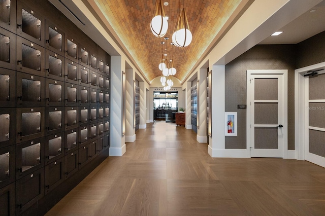 interior space featuring light parquet floors and vaulted ceiling