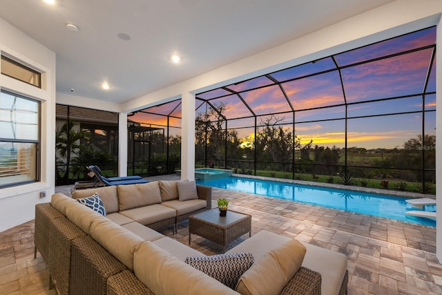 view of pool at dusk