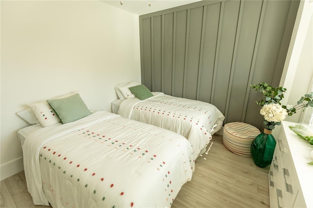 bedroom featuring light wood-style flooring