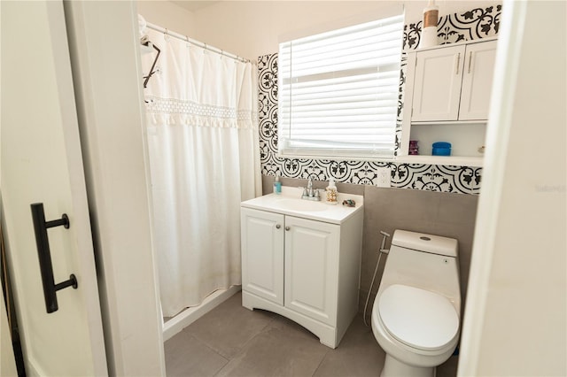 bathroom with toilet, vanity, a shower with shower curtain, and tile patterned floors