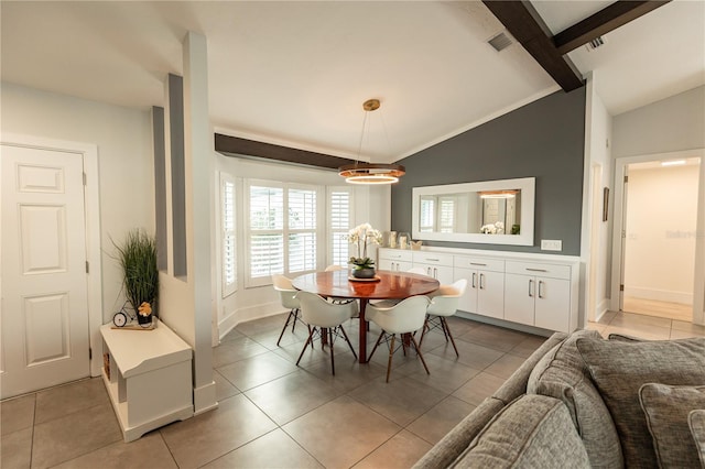 dining area with lofted ceiling with beams, light tile patterned floors, baseboards, and visible vents