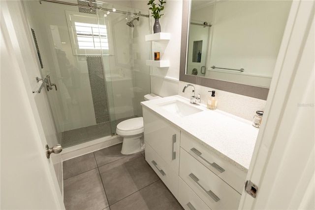 full bathroom with toilet, a stall shower, tile patterned flooring, and vanity