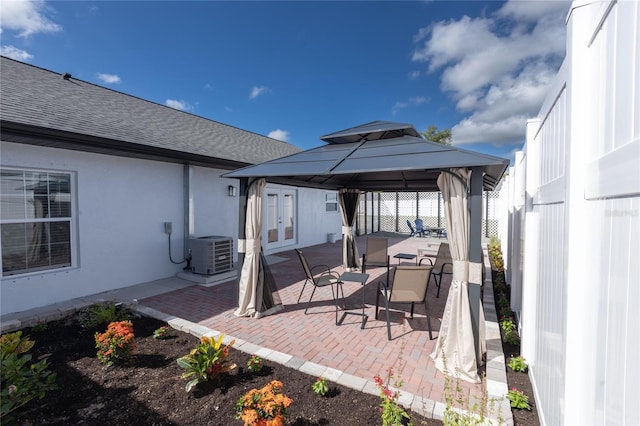 9716 28th St E, Parrish, FL 34219 - view of patio with a gazebo, cooling unit, french doors, and fence