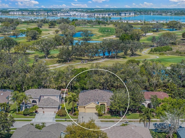 bird's eye view featuring a water view and golf course view