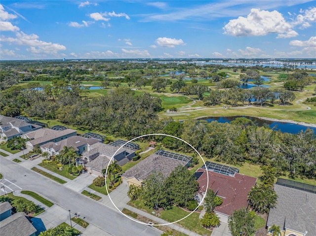 bird's eye view with view of golf course, a water view, and a residential view