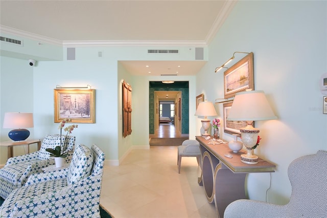 hall featuring ornamental molding and light tile patterned floors