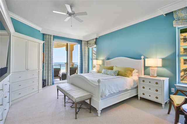 carpeted bedroom with ornamental molding, a water view, access to outside, and ceiling fan