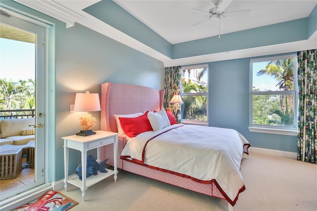 bedroom featuring baseboards, multiple windows, and carpet flooring