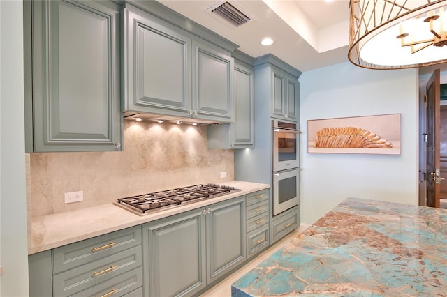 kitchen with visible vents, backsplash, recessed lighting, appliances with stainless steel finishes, and an inviting chandelier