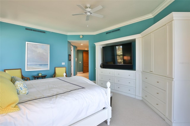 carpeted bedroom featuring crown molding and ceiling fan