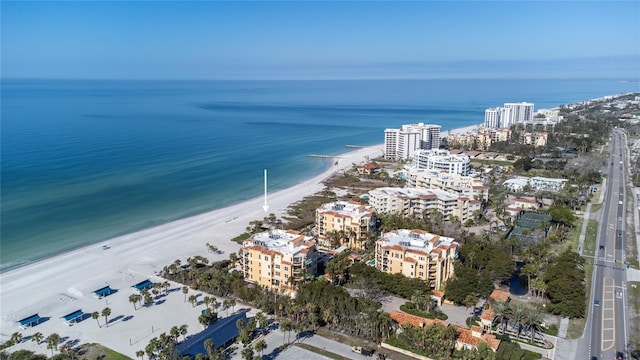 aerial view featuring a view of the beach and a water view