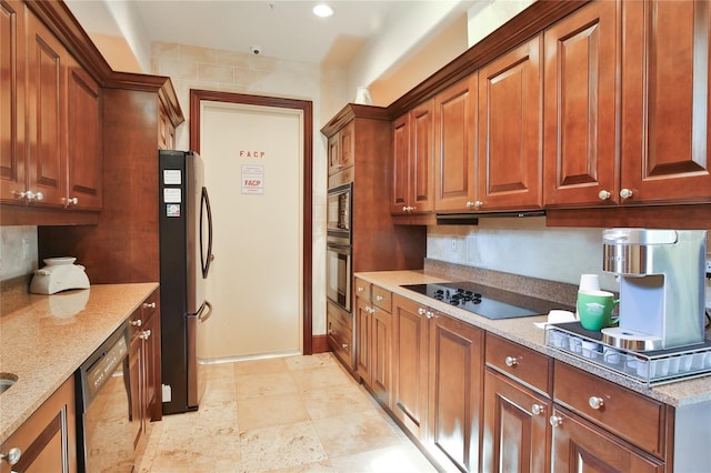 kitchen featuring under cabinet range hood, light stone countertops, black appliances, and brown cabinets