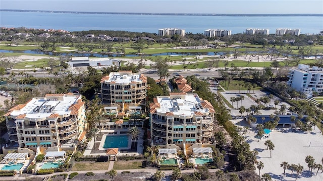 drone / aerial view featuring a water view and golf course view