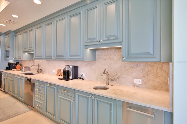 kitchen with decorative backsplash, recessed lighting, visible vents, and a sink