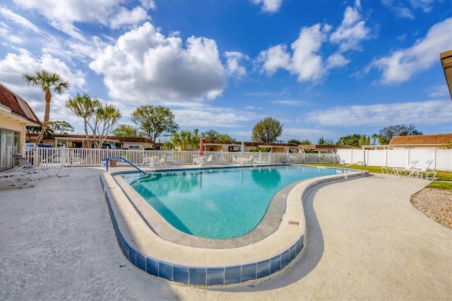 view of swimming pool with a patio