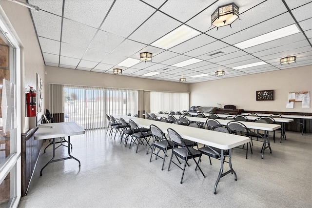 dining room with a drop ceiling