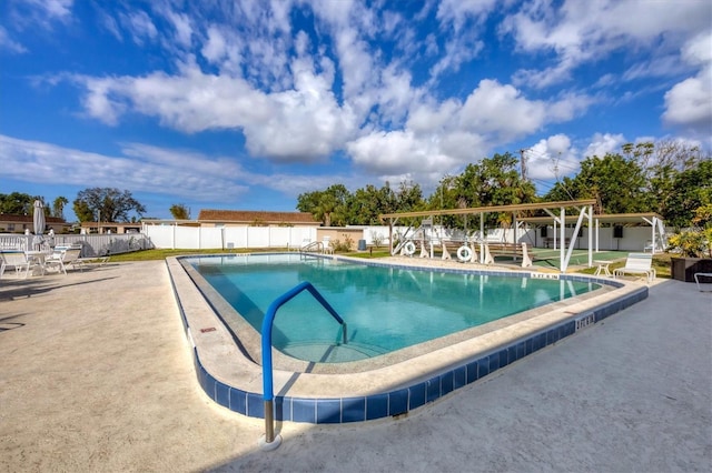 view of swimming pool with a patio area