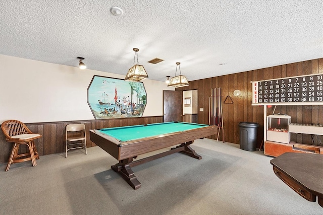 playroom featuring billiards, light carpet, a textured ceiling, and wood walls