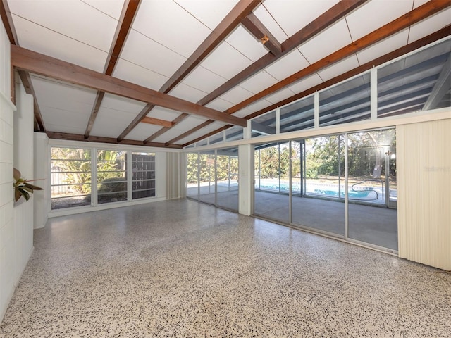 interior space with lofted ceiling with beams