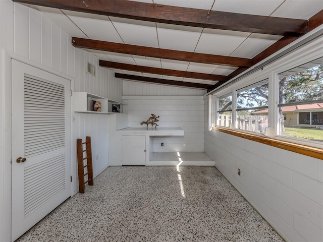 interior space with vaulted ceiling with beams