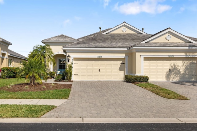 ranch-style house featuring a garage