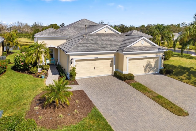 single story home featuring a garage and a front yard