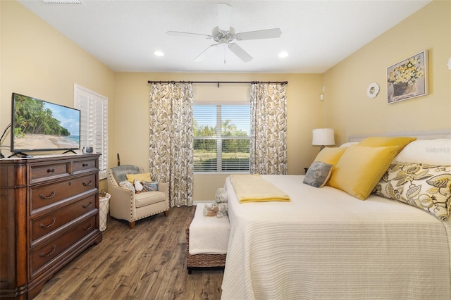 bedroom with ceiling fan and dark hardwood / wood-style floors