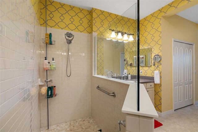 bathroom with tile patterned floors and a tile shower