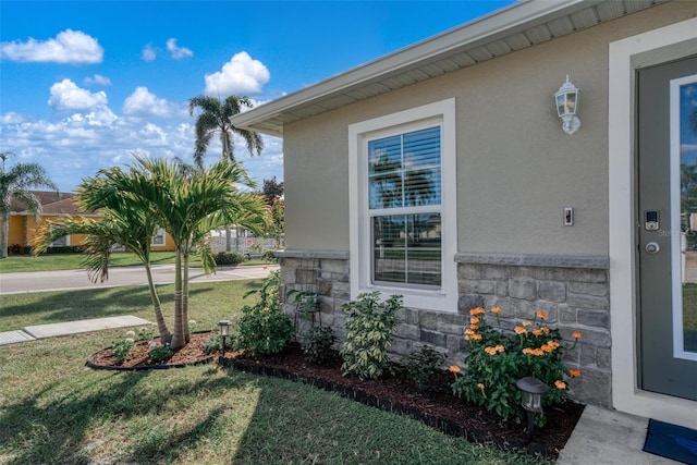 view of home's exterior featuring a yard