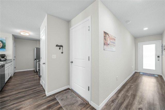 foyer entrance with dark wood-type flooring