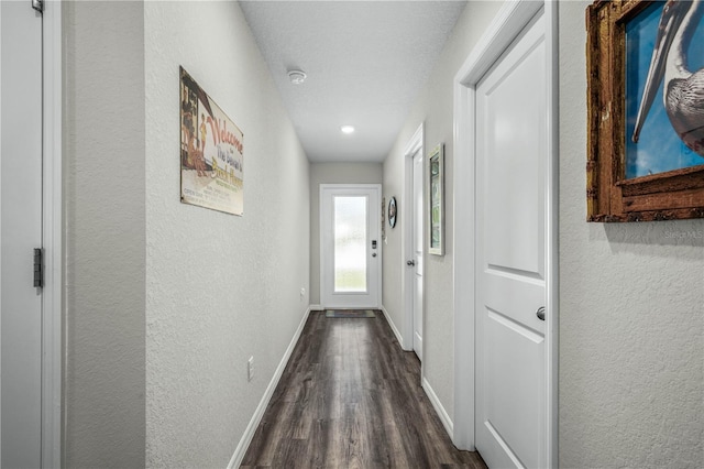 corridor featuring dark wood-type flooring