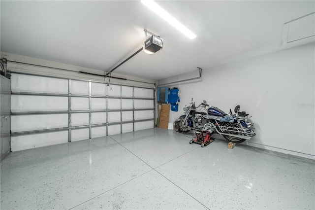 garage featuring a garage door opener