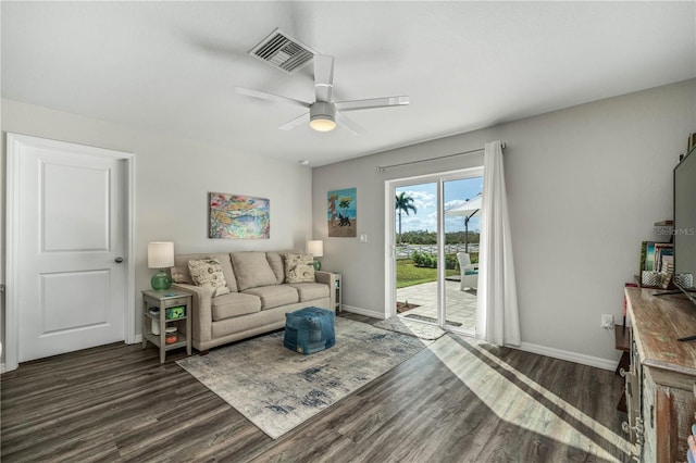 living room with ceiling fan and dark hardwood / wood-style floors