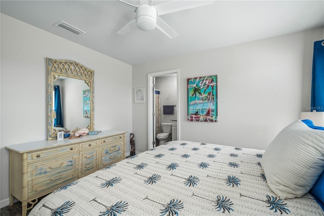 bedroom with ceiling fan and ensuite bath