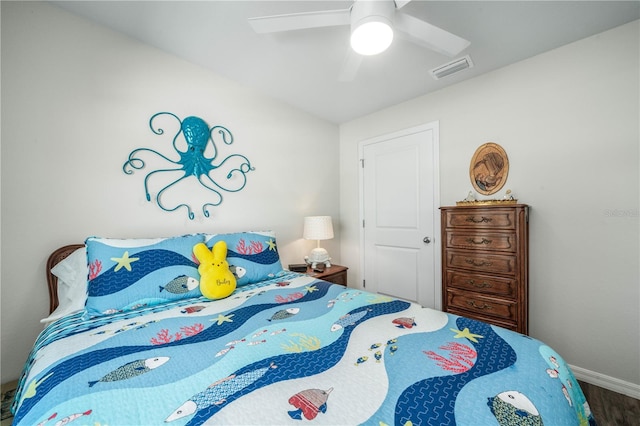 bedroom with hardwood / wood-style flooring and ceiling fan