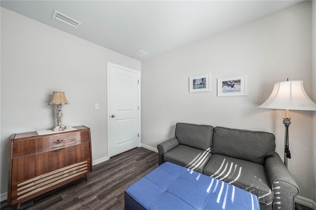 living room with dark hardwood / wood-style floors