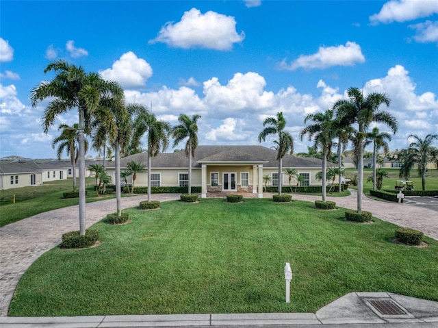 ranch-style home with a front lawn