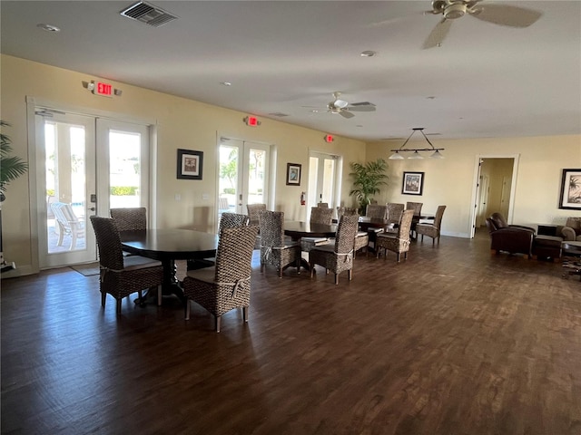 dining space featuring french doors, ceiling fan, and dark wood-type flooring