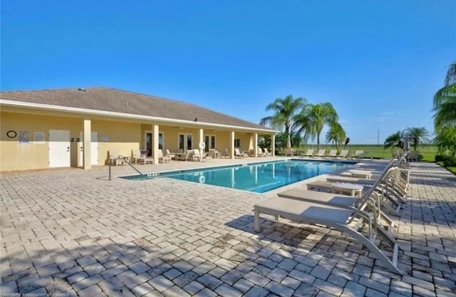 view of swimming pool with a patio