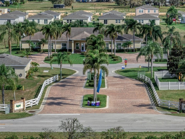 surrounding community featuring fence and a residential view