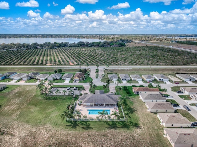 aerial view with a rural view and a water view