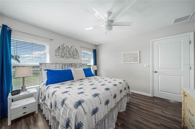 bedroom with a ceiling fan, baseboards, dark wood-style flooring, and visible vents