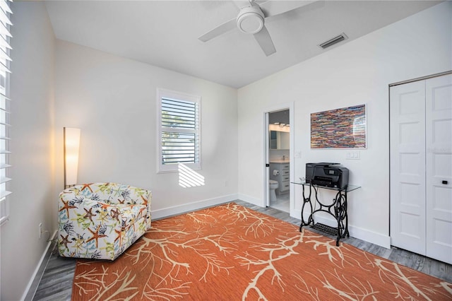 living area with ceiling fan and wood-type flooring