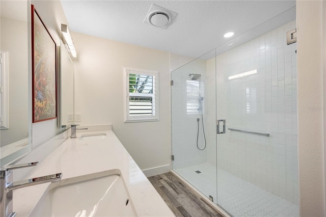 432 W Gate Dr, Venice, FL 34285 - full bath with double vanity, wood finished floors, a stall shower, and a sink