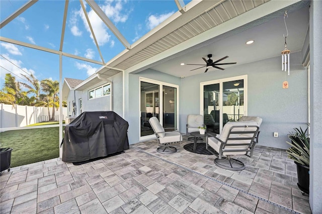 432 W Gate Dr, Venice, FL 34285 - view of patio / terrace with glass enclosure, ceiling fan, grilling area, and fence