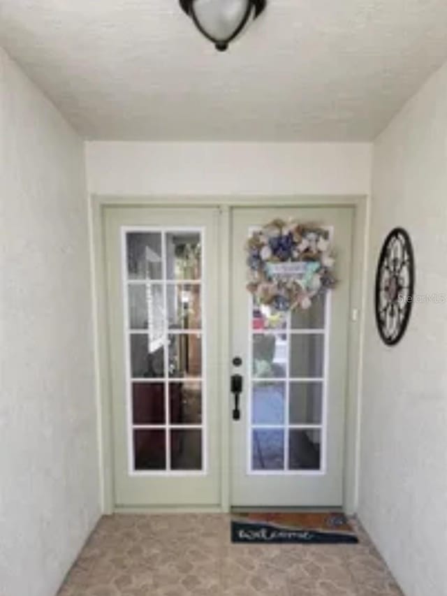 entryway featuring french doors