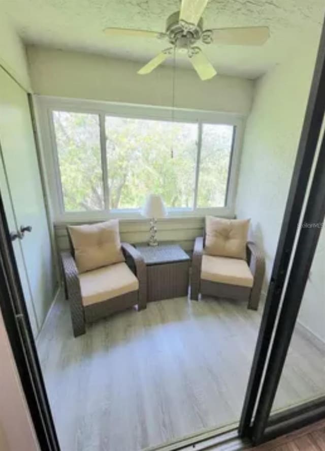 sunroom / solarium with ceiling fan