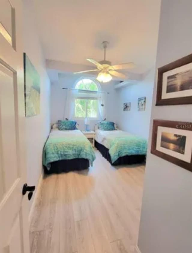 bedroom with hardwood / wood-style flooring and ceiling fan